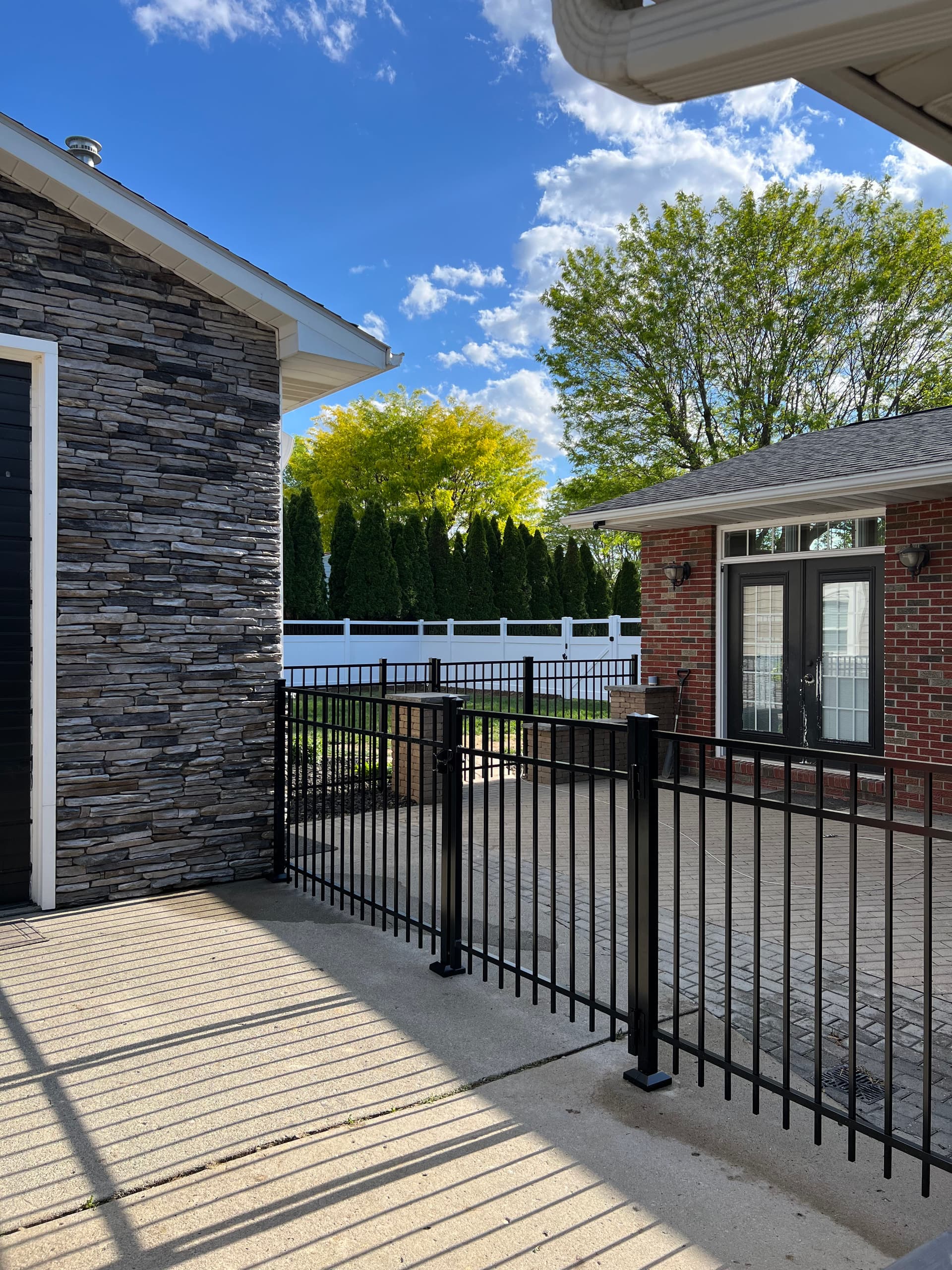 White Vinyl and Black Ornamental Fence Combo in Delphos image