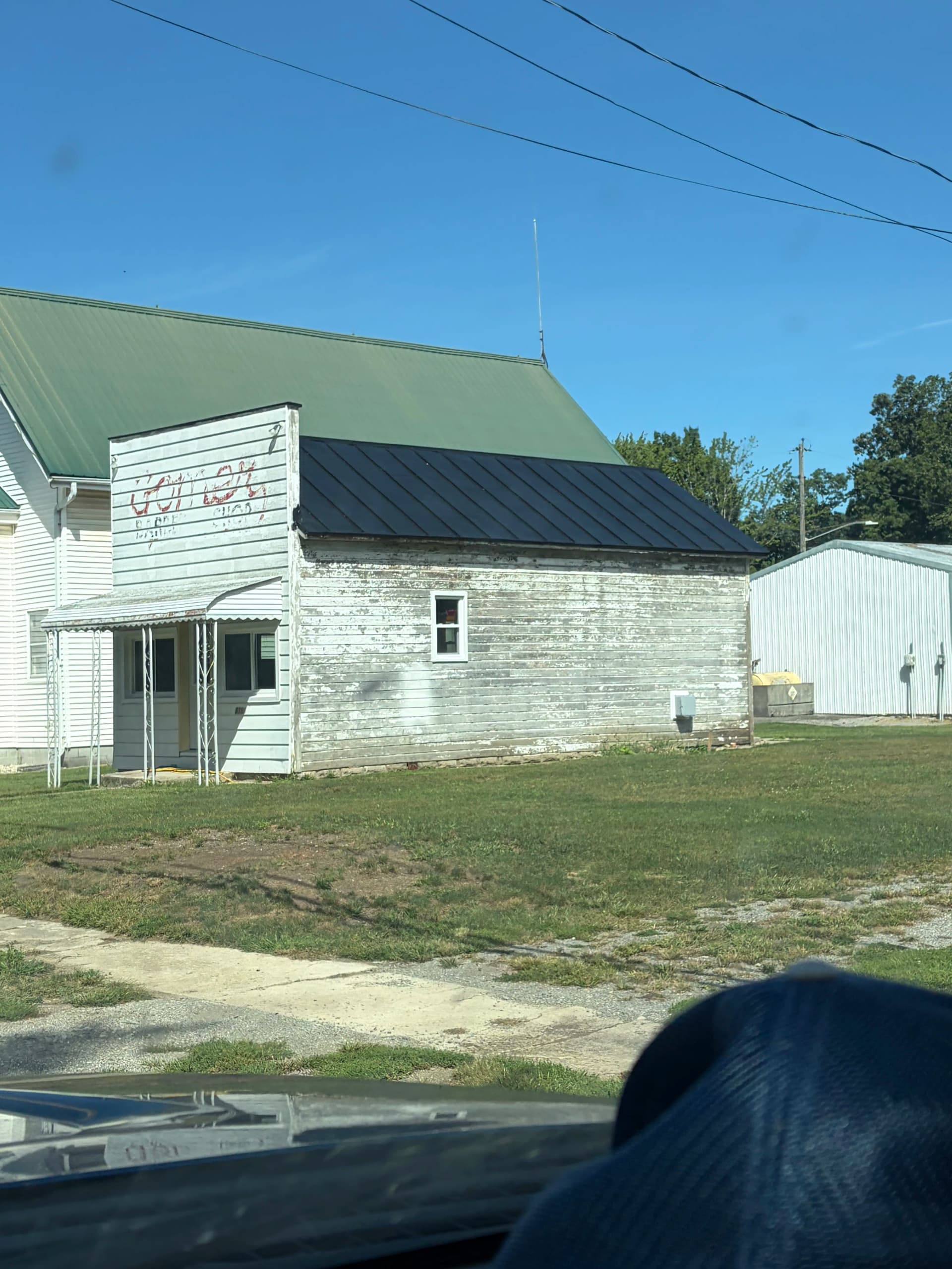 Gomer Barbershop Gets Fresh Vinyl Siding and Custom Trim