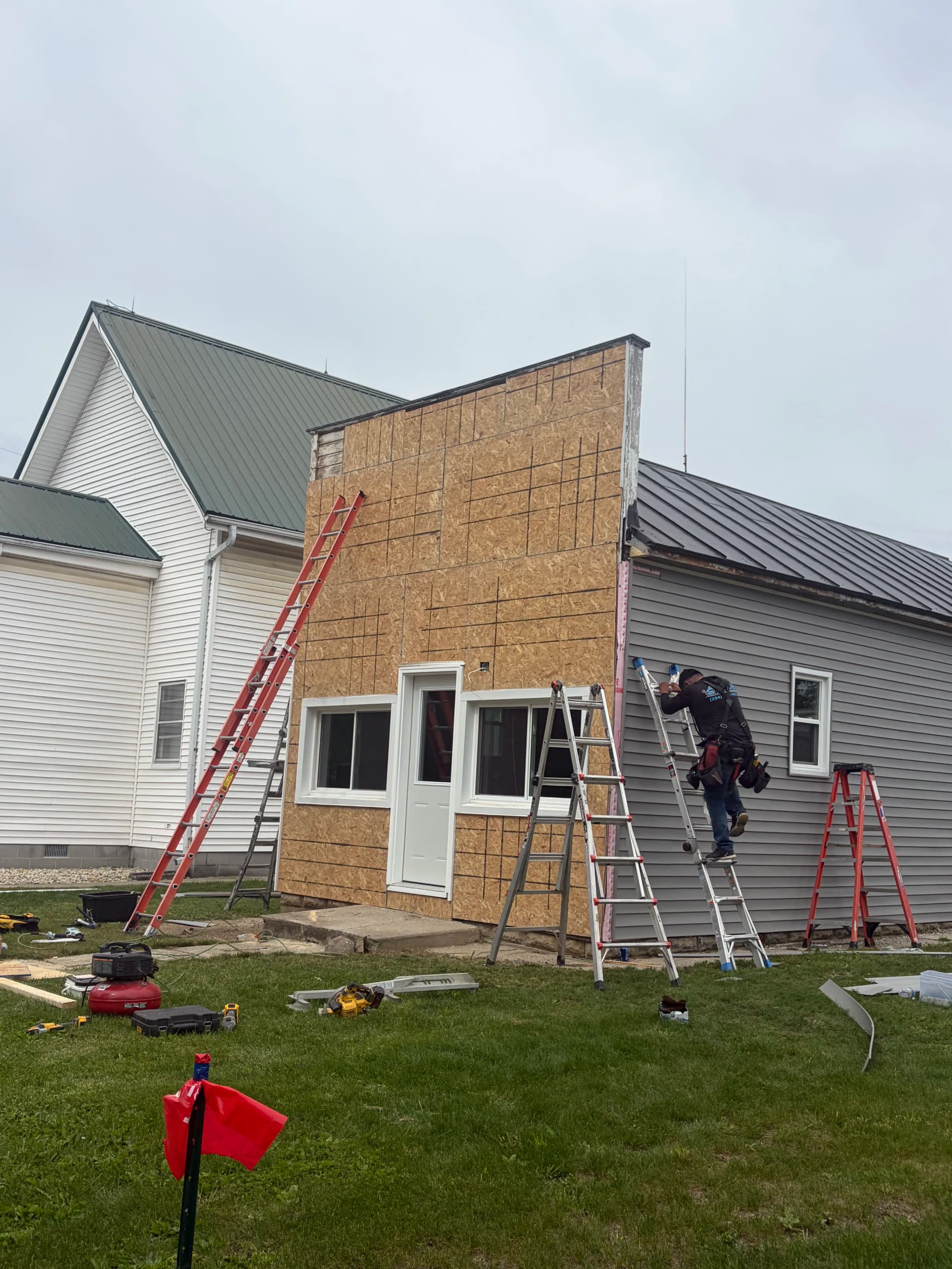 Gomer Barbershop Gets Fresh Vinyl Siding and Custom Trim