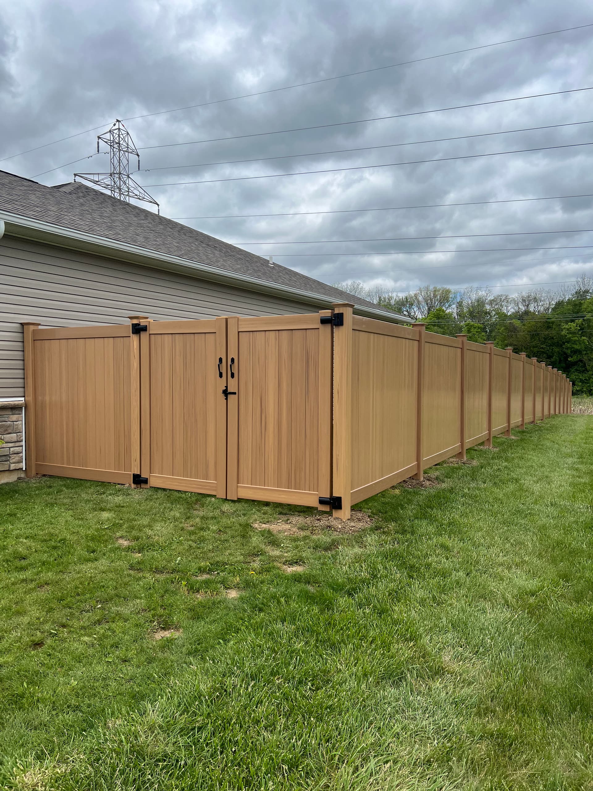 Cyprus Wood Grain Vinyl Privacy Fence Install in Shawnee image