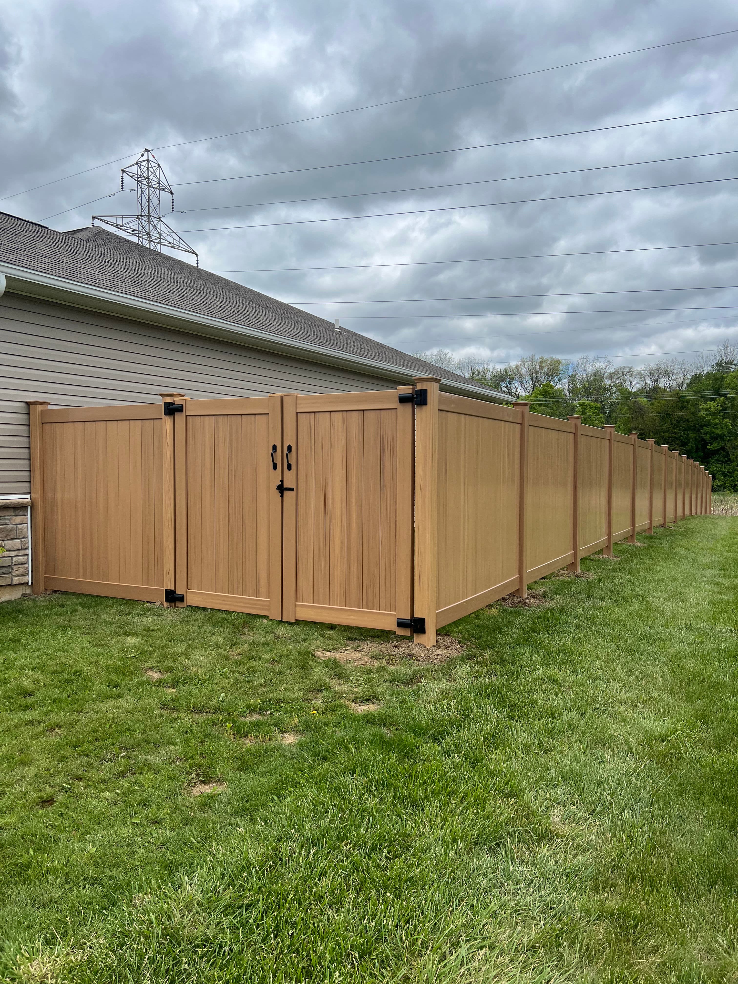 Project Cyprus Wood Grain Vinyl Privacy Fence Install in Shawnee image