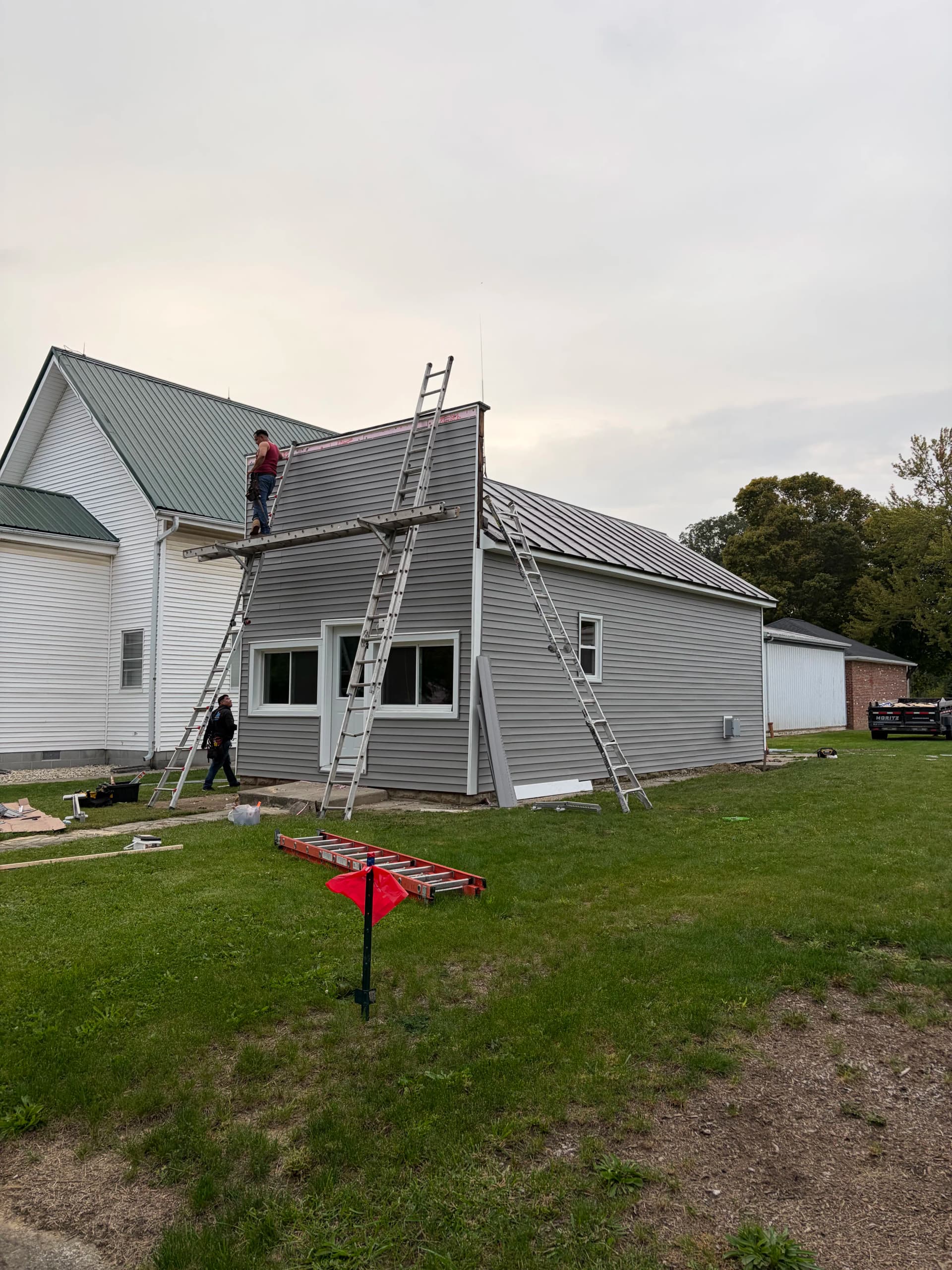 Gomer Barbershop Gets Fresh Vinyl Siding and Custom Trim